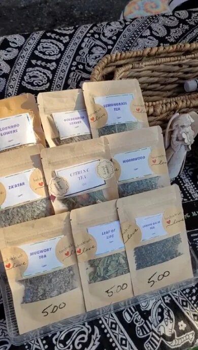 Paper bags of loose-leaf tea on the table of Mysticools Garden's booth.
